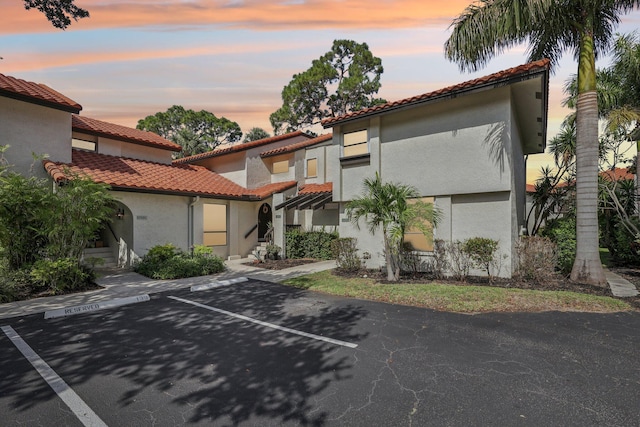 5748 Fox Hollow Dr Unit D, Boca Raton, FL 33486 - mediterranean / spanish home with uncovered parking, stucco siding, and a tile roof
