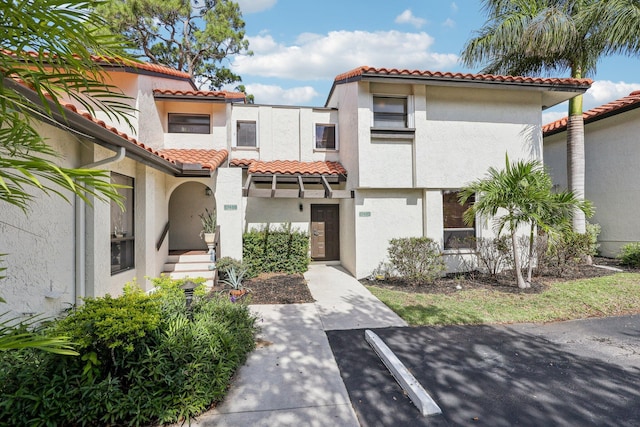 5748 Fox Hollow Dr Unit D, Boca Raton, FL 33486 - view of front of home featuring a tiled roof and stucco siding