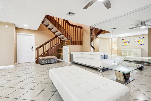 5748 Fox Hollow Dr Unit D, Boca Raton, FL 33486 - living room with stairs, ceiling fan, visible vents, and baseboards
