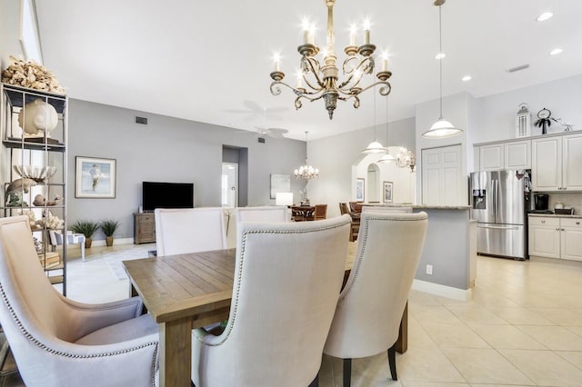 dining space with light tile patterned flooring, baseboards, visible vents, recessed lighting, and a notable chandelier