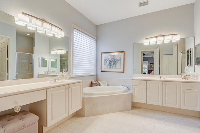 bathroom with a sink, visible vents, tile patterned floors, a shower stall, and a bath