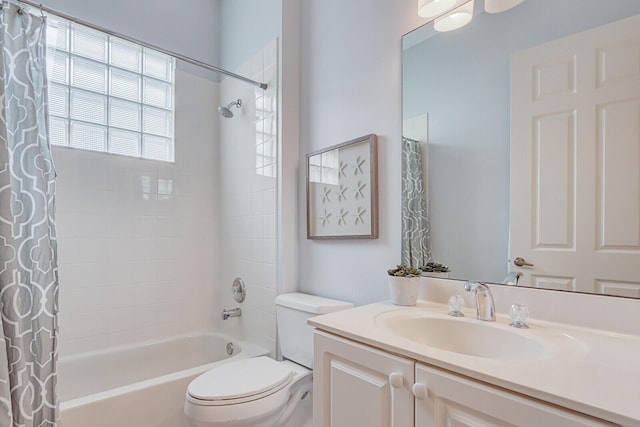 full bath featuring shower / bath combination with curtain, toilet, and vanity