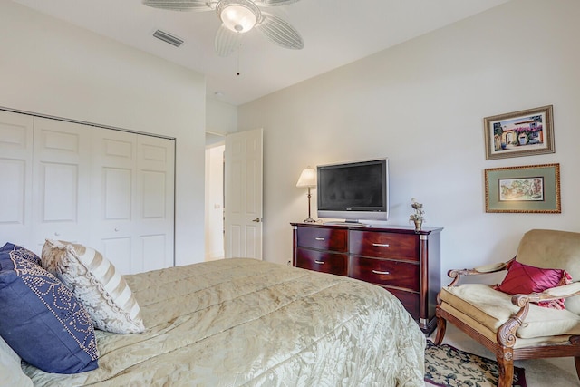 bedroom with ceiling fan, a closet, and visible vents
