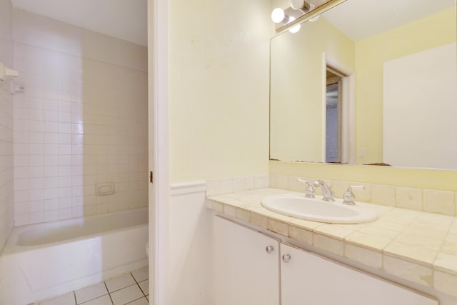 full bathroom featuring tile patterned floors,  shower combination, and vanity