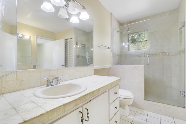 full bath featuring vanity, toilet, tile patterned flooring, and a stall shower