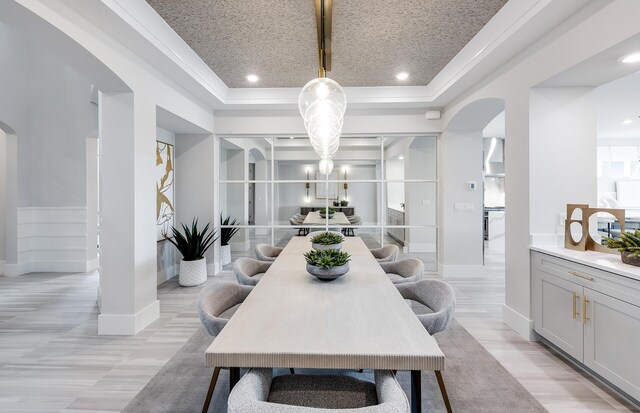 20136 Se Bridgewater Drive Livingston Model, Jupiter, FL 33458 - dining area featuring baseboards, arched walkways, a tray ceiling, and recessed lighting