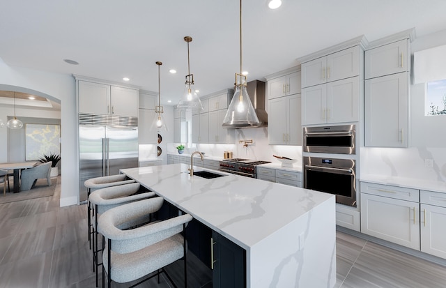 20136 Se Bridgewater Drive Livingston Model, Jupiter, FL 33458 - kitchen with recessed lighting, a sink, wall chimney exhaust hood, and high quality appliances