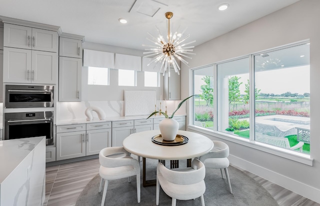 20136 Se Bridgewater Drive Livingston Model, Jupiter, FL 33458 - dining room featuring recessed lighting, light wood-style flooring, and a chandelier