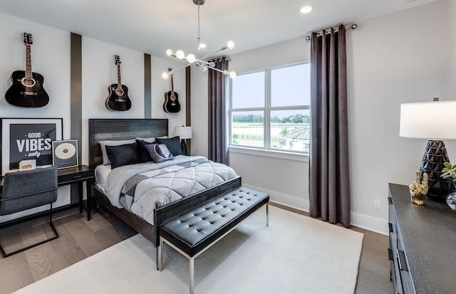 20136 Se Bridgewater Drive Livingston Model, Jupiter, FL 33458 - bedroom featuring baseboards, a notable chandelier, and wood finished floors