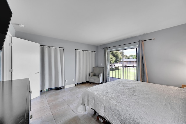 1625 Meadows Cir W, Boynton Beach, FL 33436 - bedroom featuring access to outside and light tile patterned floors