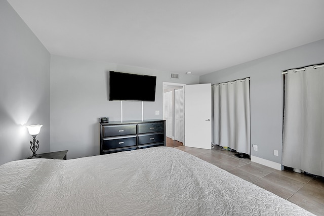 1625 Meadows Cir W, Boynton Beach, FL 33436 - bedroom featuring tile patterned floors and baseboards