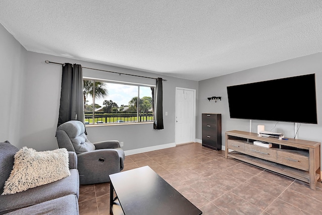 1625 Meadows Cir W, Boynton Beach, FL 33436 - tiled living room featuring a textured ceiling and baseboards
