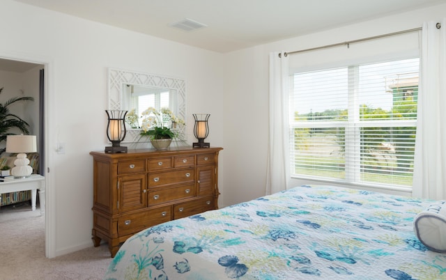 12134 SW Rimini Way, Port Saint Lucie, FL 34987 - bedroom with light carpet and visible vents