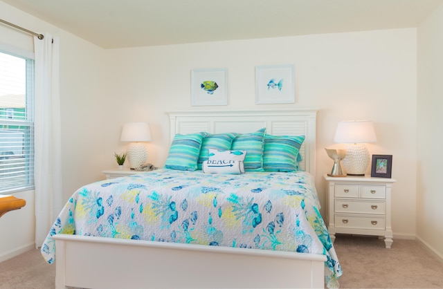 12134 SW Rimini Way, Port Saint Lucie, FL 34987 - bedroom featuring baseboards and carpet