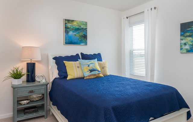 12134 SW Rimini Way, Port Saint Lucie, FL 34987 - bedroom featuring baseboards and carpet