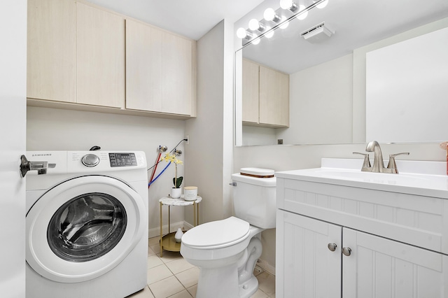 bathroom featuring tile patterned flooring, vanity, washer / dryer, toilet, and baseboards