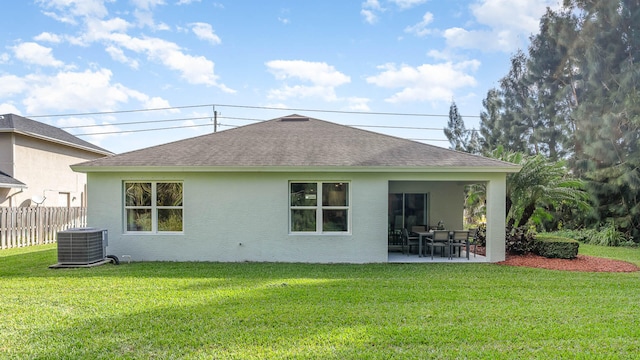3284 SW 23rd St, Okeechobee, FL 34972 - rear view of property with roof with shingles, stucco siding, a yard, and a patio area