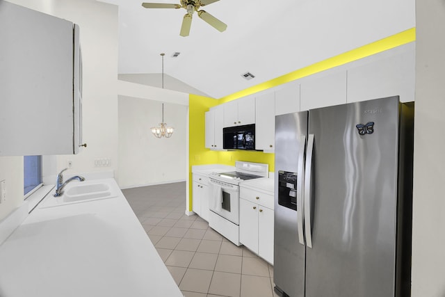 kitchen with lofted ceiling, black microwave, white electric range oven, stainless steel refrigerator with ice dispenser, and a sink