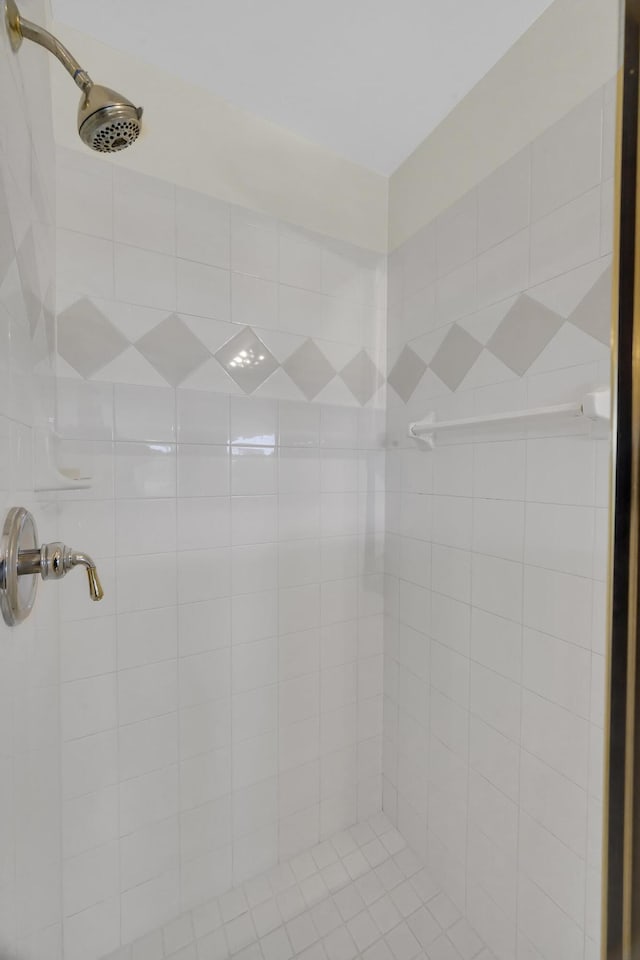 full bath featuring tiled shower