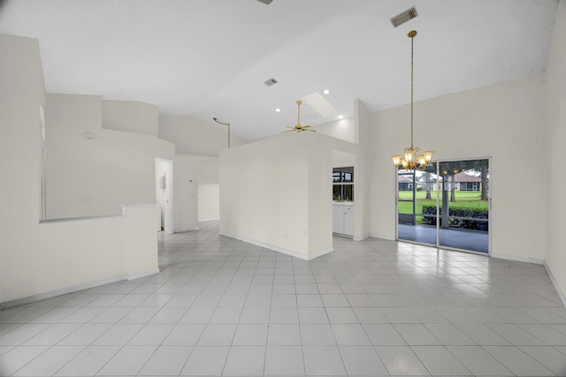 empty room with visible vents, light tile patterned flooring, baseboards, high vaulted ceiling, and ceiling fan with notable chandelier