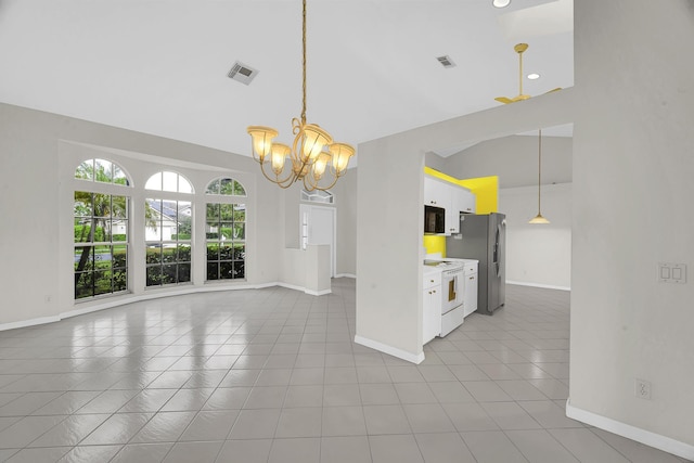 interior space featuring an inviting chandelier, baseboards, high vaulted ceiling, and visible vents