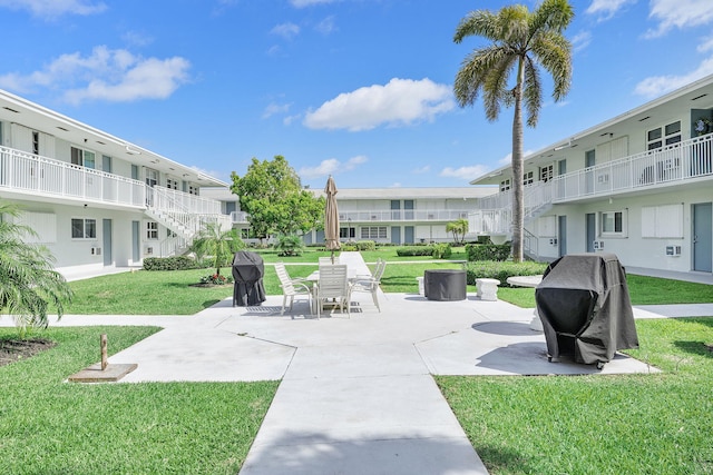 2520 S Federal Hwy Unit 14, Boynton Beach, FL 33435 - view of home's community with a lawn, a patio area, stairs, and a residential view