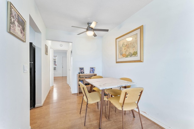 2520 S Federal Hwy Unit 14, Boynton Beach, FL 33435 - dining area with light wood-style floors, baseboards, a ceiling fan, and a textured ceiling
