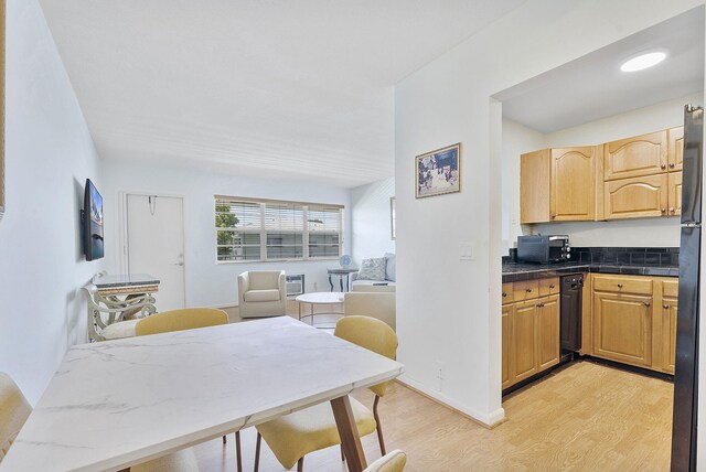 2520 S Federal Hwy Unit 14, Boynton Beach, FL 33435 - kitchen with baseboards, light wood finished floors, black appliances, and dark countertops