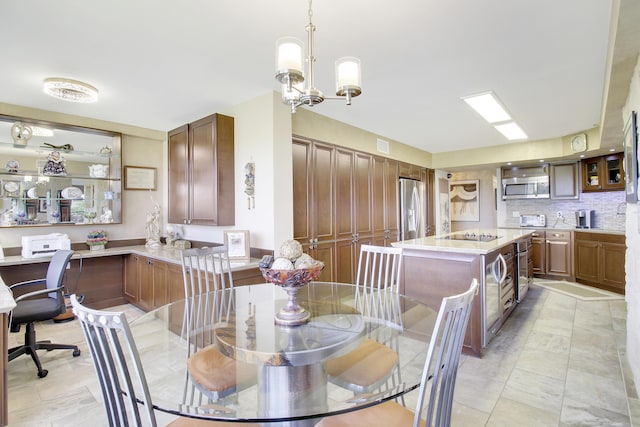 dining space with a notable chandelier