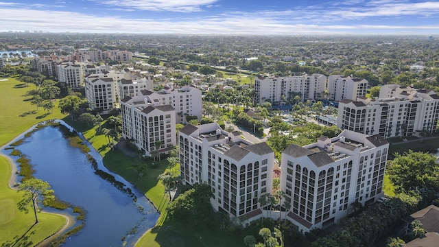 aerial view featuring a water view and golf course view