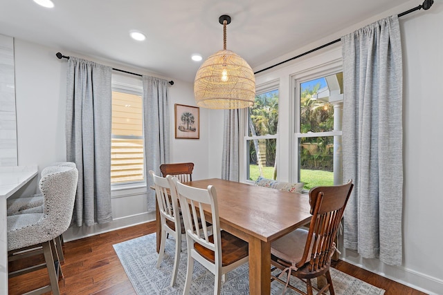 dining area featuring dark wood-type flooring, recessed lighting, and baseboards