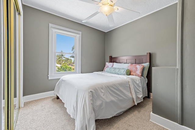 bedroom featuring baseboards, carpet, and ceiling fan