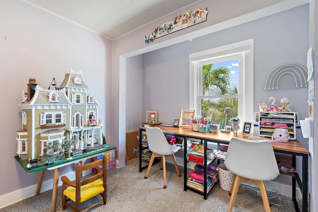 carpeted office space featuring baseboards
