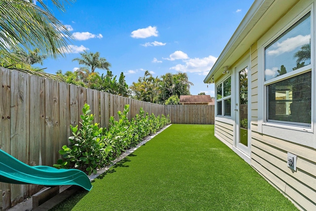 view of yard with a fenced backyard