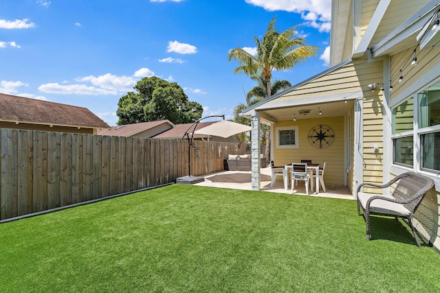 view of yard featuring fence and a patio area