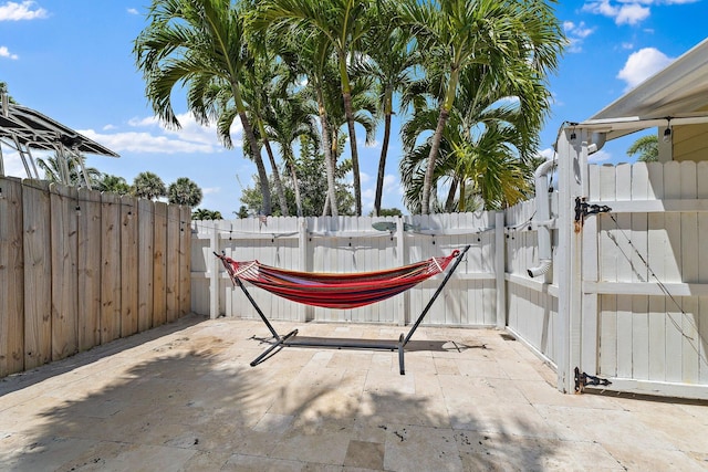 view of patio / terrace with fence and a gate