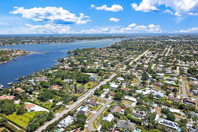birds eye view of property featuring a water view and a residential view
