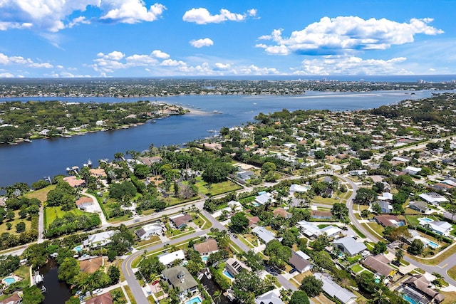 bird's eye view featuring a water view and a residential view