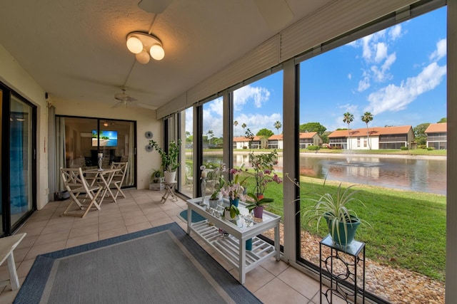 10223 N Circle Lake Dr Unit 102, Boynton Beach, FL 33437 - sunroom featuring a water view, ceiling fan, tile patterned flooring, and a residential view