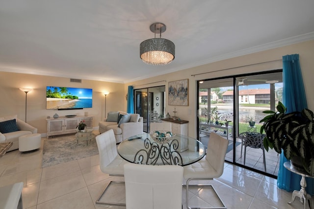 10223 N Circle Lake Dr Unit 102, Boynton Beach, FL 33437 - dining space featuring crown molding, light tile patterned flooring, and visible vents
