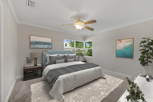 carpeted bedroom featuring ornamental molding, baseboards, and a ceiling fan