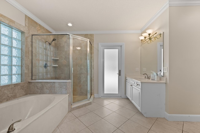 full bath with tile patterned floors, a stall shower, crown molding, a garden tub, and vanity