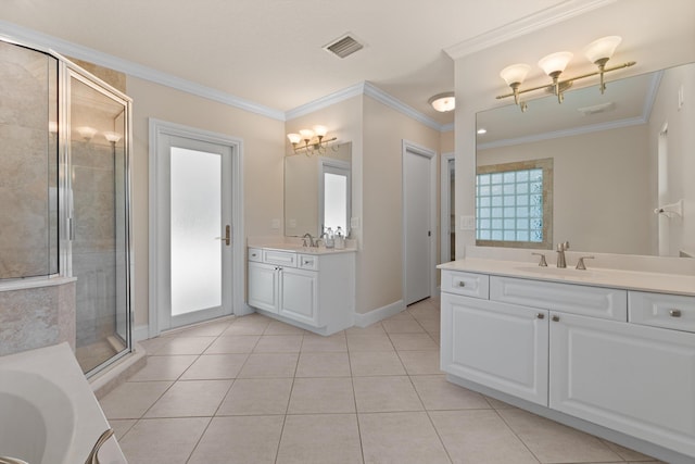 full bath with a stall shower, tile patterned floors, ornamental molding, two vanities, and a garden tub