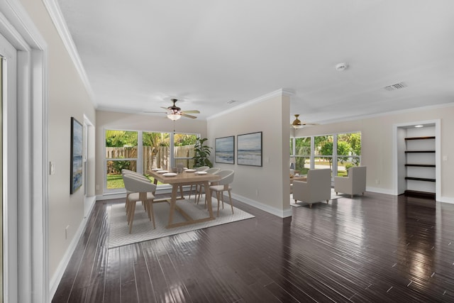 dining room featuring a ceiling fan, dark wood finished floors, healthy amount of natural light, and ornamental molding