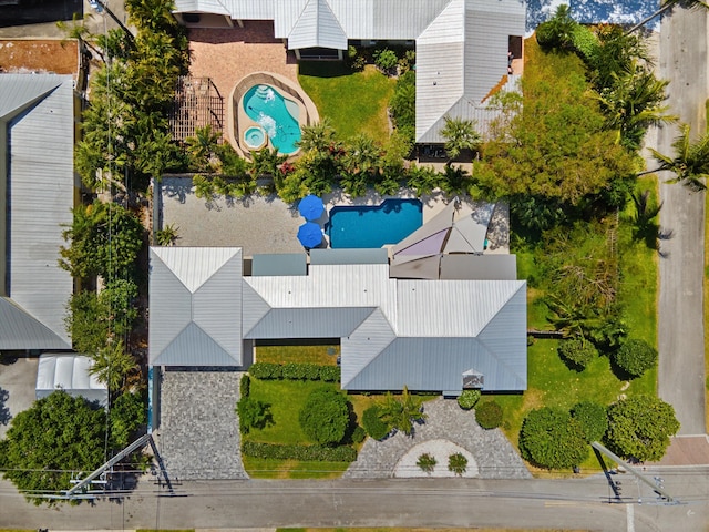 view of subject property with a pool area