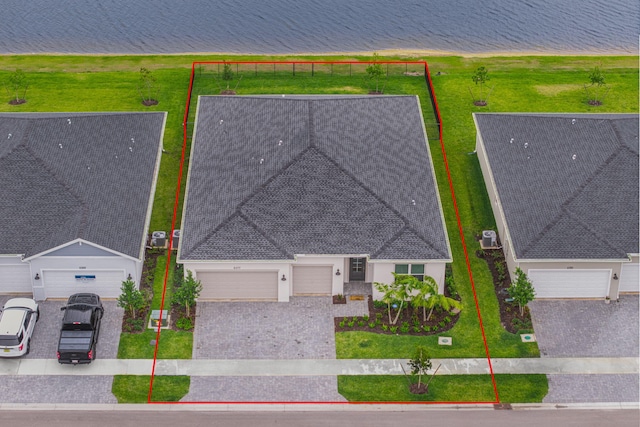 birds eye view of property featuring a water view