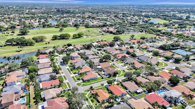 drone / aerial view featuring a water view and golf course view