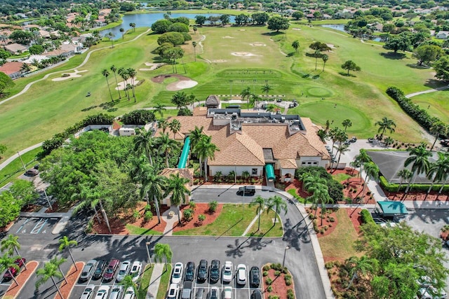 drone / aerial view featuring a water view and view of golf course