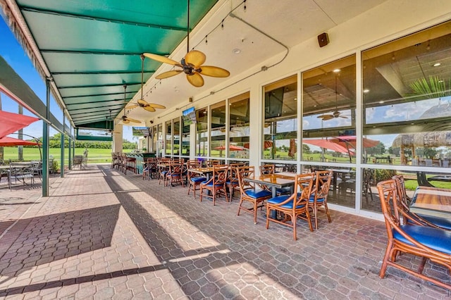view of patio featuring ceiling fan