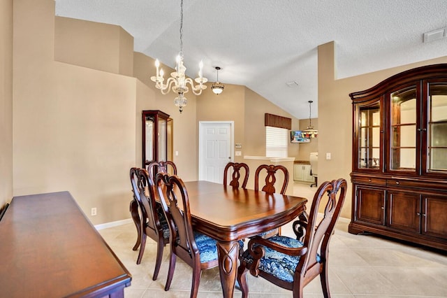 dining room featuring an inviting chandelier, visible vents, lofted ceiling, baseboards, and light tile patterned floors